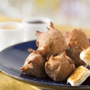 Warm homemade banana fritters dusted with sugar and cinnamon