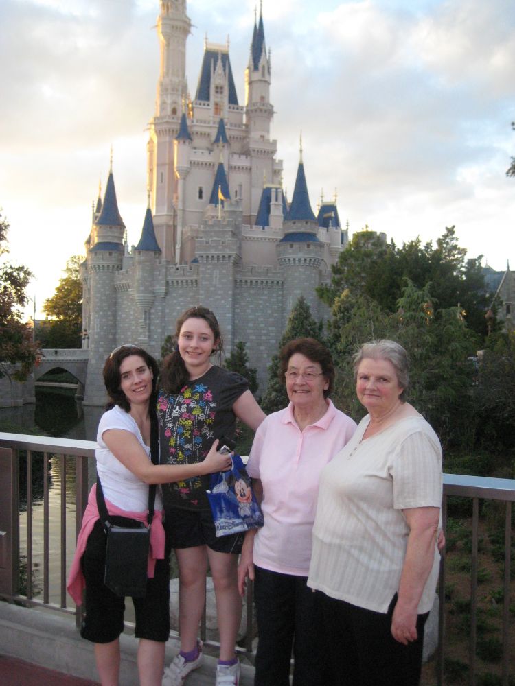 3 generations standing at Cinderella Castle